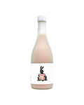 A frosted glass bottle filled with an opaque pale pink liquid (omija makgeolli), featuring a white label with a black rabbit illustration holding a red sign that reads 'Black Rabbit'.

Black Rabbit Makgeolli - Sulsaem - cultsool