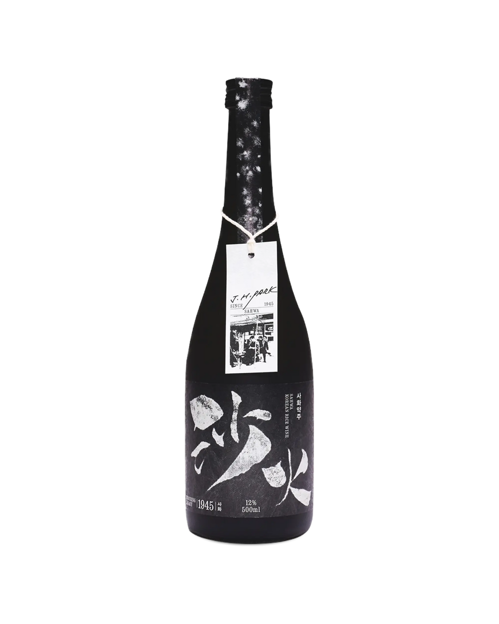 A single black bottle of Korean rice wine with white calligraphy on the label, a hanging white product tag, and a dark floral wrap, photographed against a plain white background. Sahwa Yakju - Good Tomorrow Brewery - cult