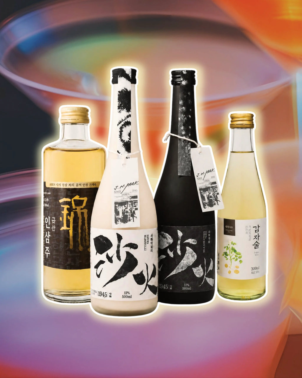 Four Korean rice wine (sake) bottles arranged together against a vibrant, abstract multicolor background with a glowing white outline effect. The bottles include different styles: a clear glass bottle with golden liquid and a black label, a white glass bottle with a black label, a dark black glass bottle with a black label, and a clear glass bottle with pale yellow liquid and a white label.
